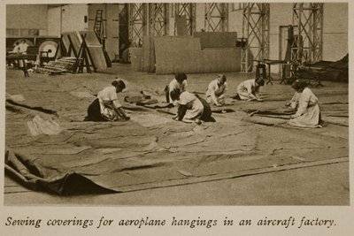 Sewing coverings for aeroplane hangings in an aircraft factory by English Photographer